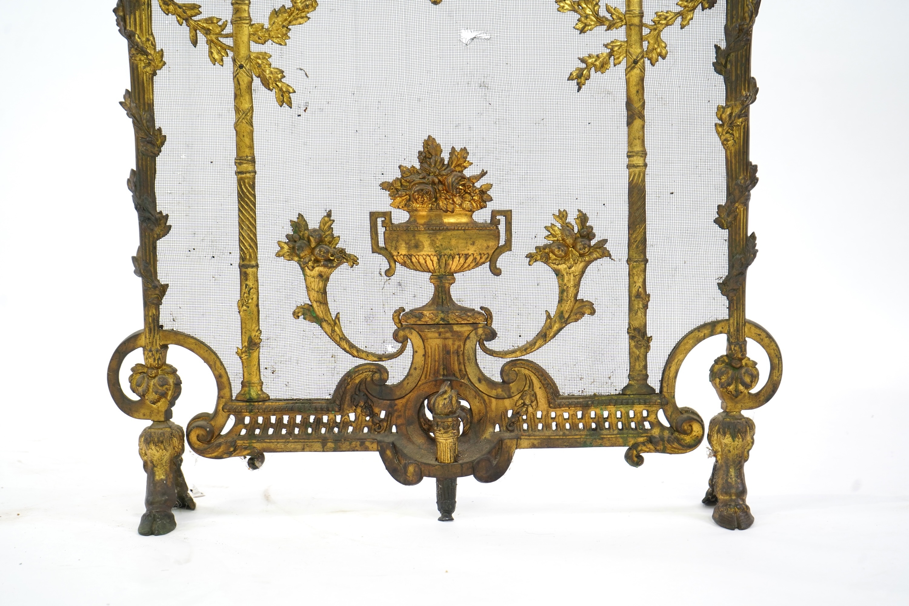 A Louis XVI style gilt bronze and iron mesh fireguard, late 19th century